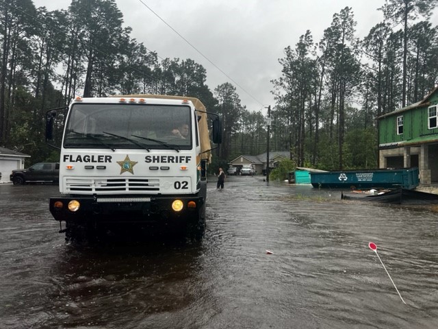 The FCSO Emergency Response Team truck drives through a flooded street during Hurricane Ian